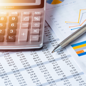 Pen and Calculator on business data report