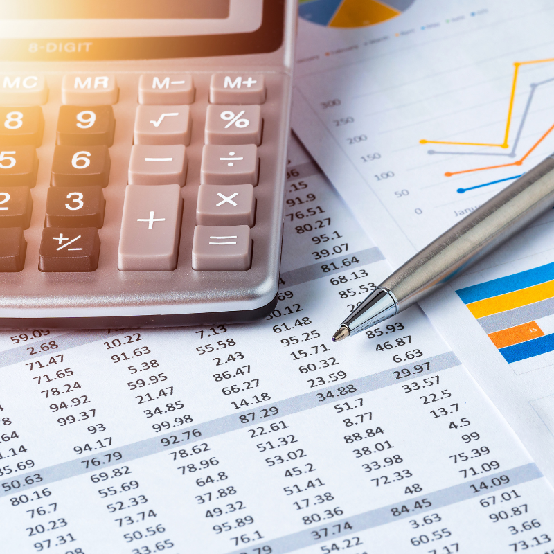 Pen and Calculator on business data report