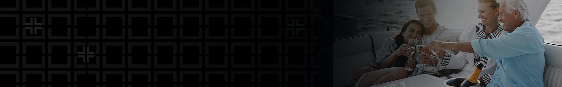 Image of a family all sitting around a table on a boat cheersing their glasses.