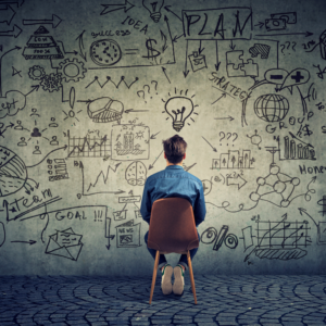 A man brainstorming on project management for Capacity Planning.