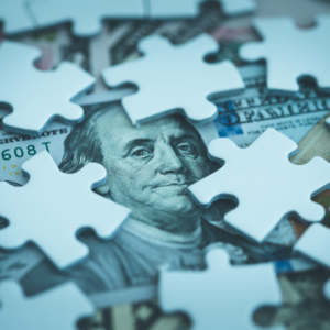 money and puzzle pieces